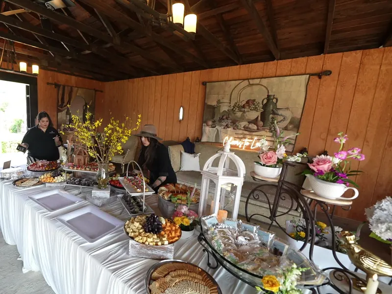 Covered patio grazing spread with florals and lanterns at a Brisbane afternoon event