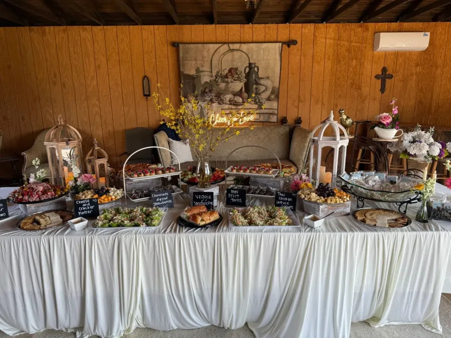 Grazing table of charcuterie, cheeses, fruit, and crostini styled for a San Francisco cocktail reception by SF Catering Company